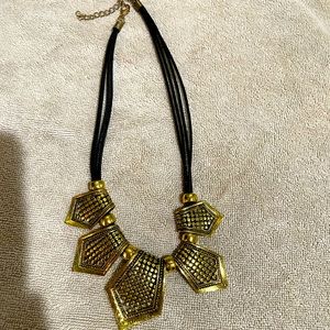 Vintage gold metal and black rope necklace costume jewelry